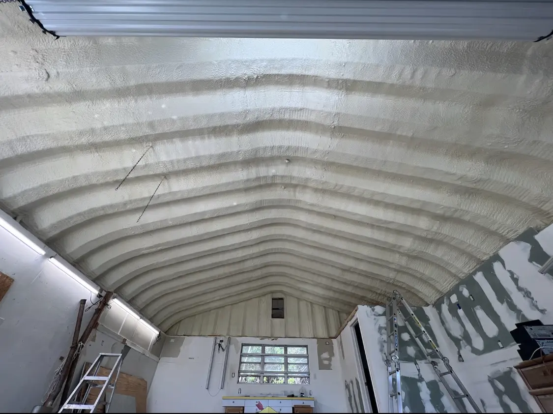 Spray polyurethane foam applied to the underside of a metal roof deck in Tontitown